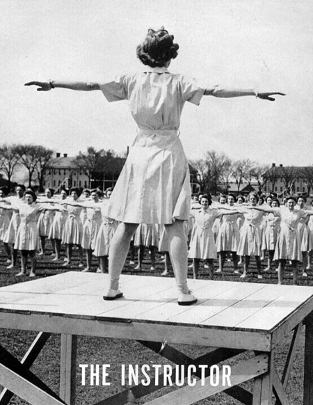 A Women’s Army Corps physical training instructor leading a calisthenic drill